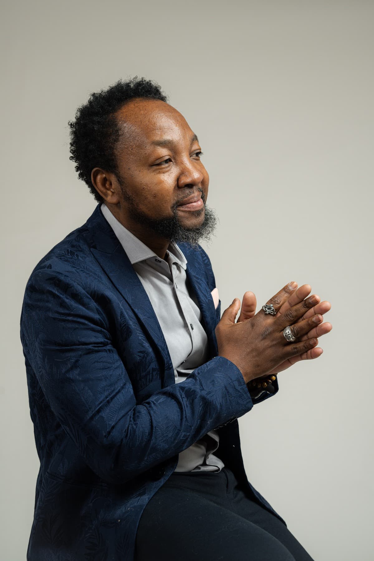 James St Pierre, owner and dual-licensed barber and cosmetologist at Salon St Pierre, specializing in all hair types and textures including Black and natural hair
