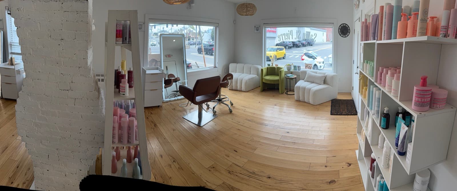 Salon St Pierre lounge area with retail display
